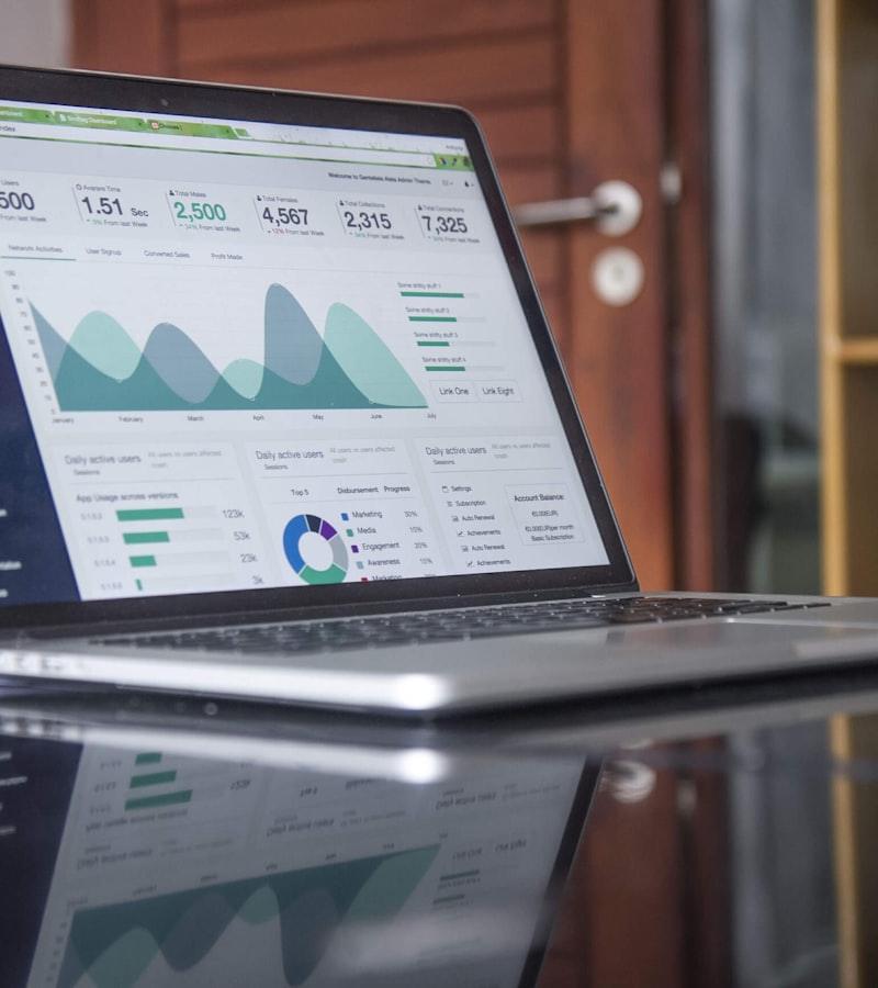 Paid media performance report on a laptop screen